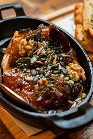 Melted cheese with nuts and honey